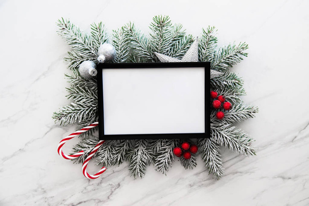 Christmas frame background with xmas tree branches and xmas decorations.  - 写真・画像