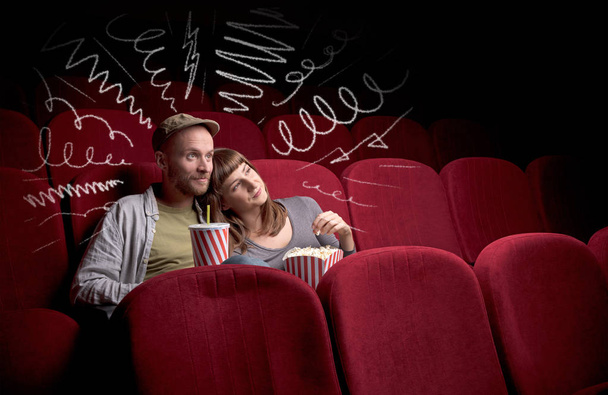 Cute couple in cinema watching movie  - Zdjęcie, obraz