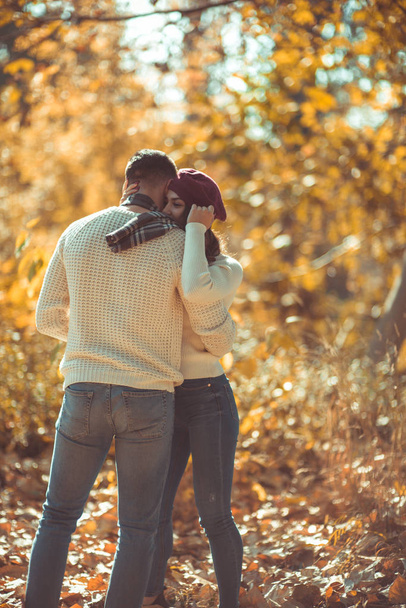Beautiful couple in love is in the park, they are hugging and enjoying in the nature - Фото, зображення