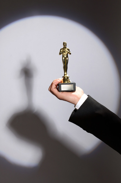 Oscar award in hand - Foto, Bild