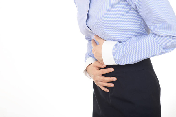 Woman who has a stomachache - 写真・画像