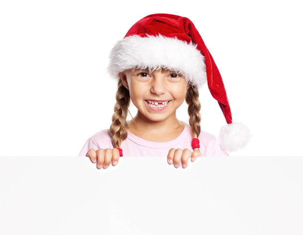 Happy little girl in Santa hat - Foto, afbeelding