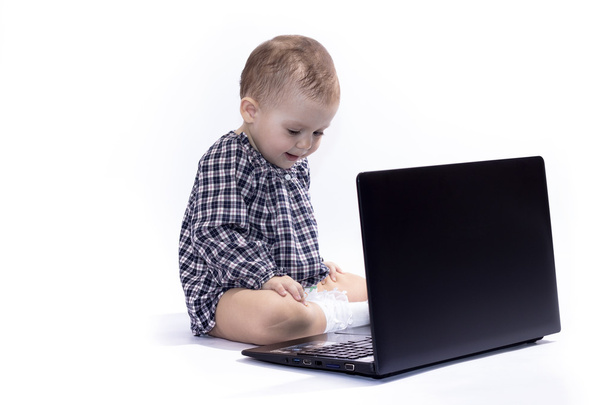 baby playing with a laptop - Фото, зображення