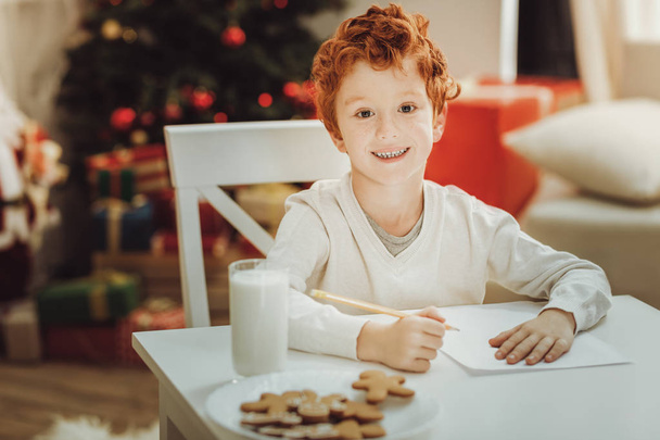 Attractive boy writing letter to Santa - Foto, imagen