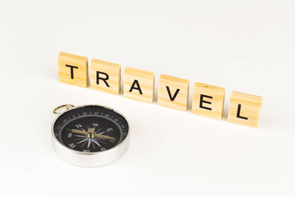 Travel Word In Wooden Cube with compass. - Photo, Image