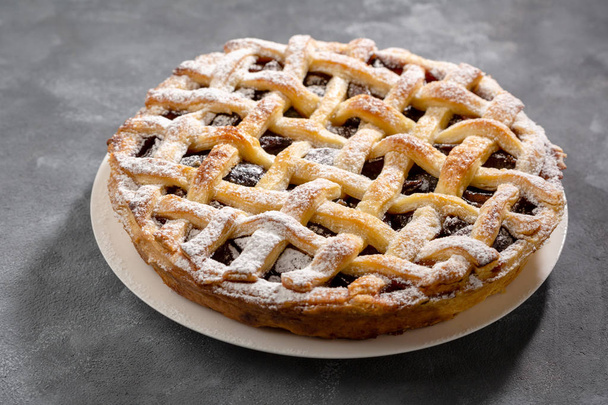 Autumn pie on gray background - Фото, изображение