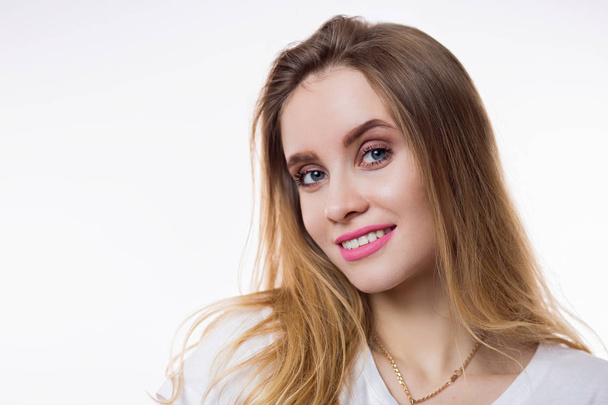 Closeup portrait of beautiful happy young woman with blonde hair and looking at camera on white background on a white background. Expressive facial expressions emotions - Φωτογραφία, εικόνα