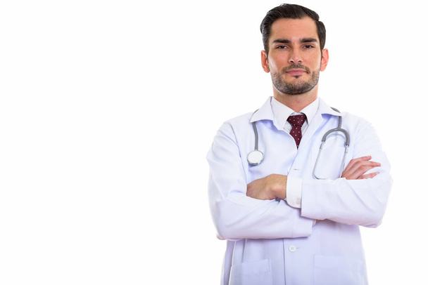 Студійний знімок молодого красивого чоловіка лікаря зі схрещеними руками
 - Фото, зображення