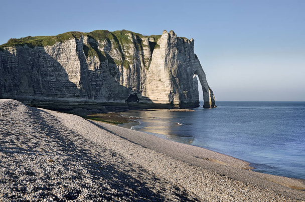 Famous pebble beach and cliff Aval of Etretat, commune in the Seine-Maritime department in the Haute-Normandie region in northwestern France - Photo, Image