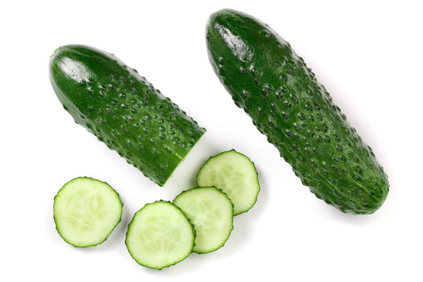 Cucumber slices isolated on white background. Top view. Flat lay pattern - Photo, Image
