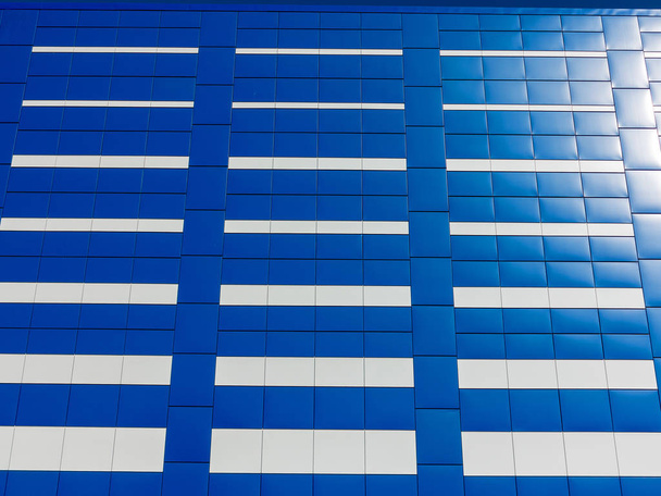 Background of blue and white facade tiles of modern building. Blue tile wall texture background - Fotó, kép