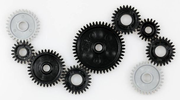 Several gears that are in connection with each other on a white background - Foto, Imagem