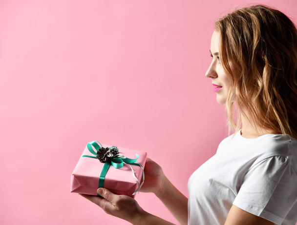 Beautiful woman composition hold pink and pastel green Christmas present gift for new year celebration - Fotoğraf, Görsel