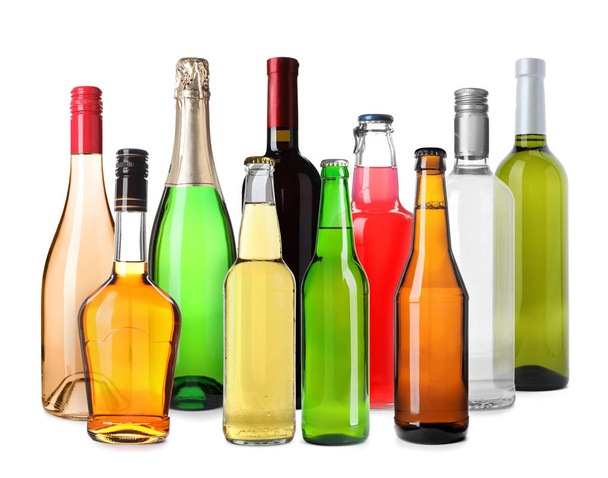 Set of bottles with different drinks on white background - Foto, Imagen