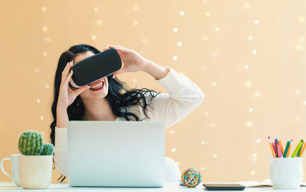 Young woman using a virtual reality headset - Photo, image