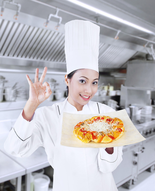 Beautiful chef and delicious pizza - Photo, image