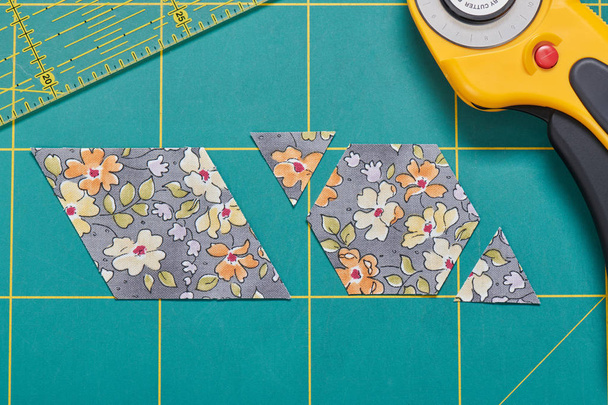 The process of cutting pieces of fabric in the shape of hexagons to create a quilt - Photo, Image