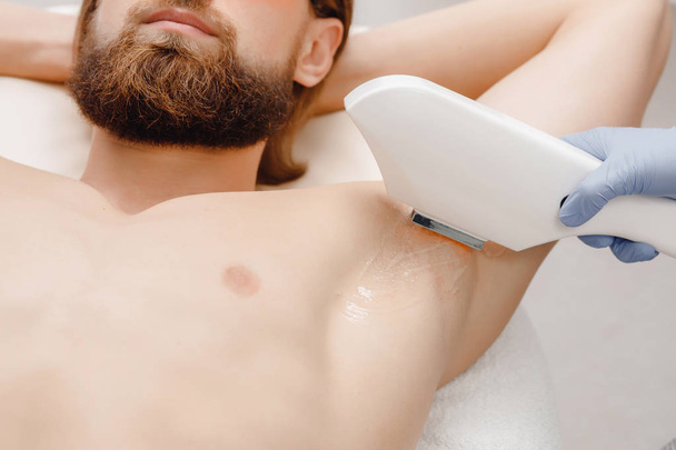 Smooth skin man under arms. Laser hair removal. - Photo, Image