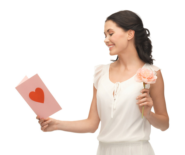 Young woman holding flower and postcard - Foto, Imagen