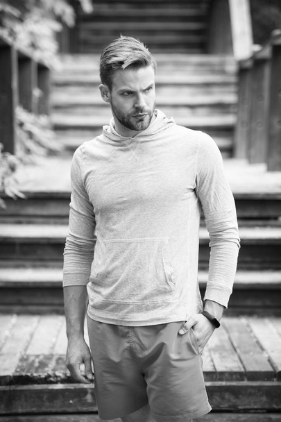 Bearded man stand at stairs outdoor. Confident sportsman in casual style, fashion. Ready for workout. Training on fresh air. Future and success. Sport and fitness - Foto, Imagen
