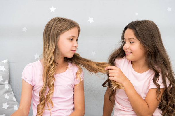 Girls sisters spend pleasant time communicate in bedroom. Benefits having sister. Awesome perks of having sister. Sisters older or younger major factor in siblings having more positive emotions - Photo, Image