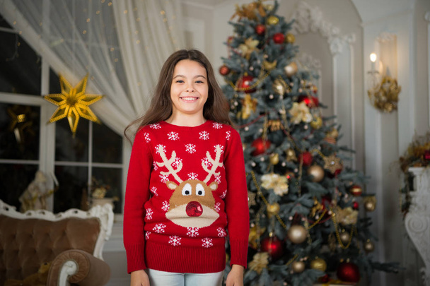 The morning before Xmas. New year holiday. Happy new year. small happy girl at christmas. Christmas. Kid enjoy the holiday. little child girl likes xmas present. Christmas composition. happiness - Photo, image