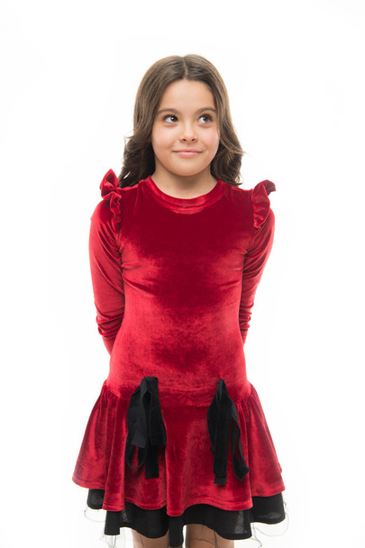 Fashion concept. Kid adorable smiling posing in red velvet dress. Kids fashion. Girl cute child wear velvet dress. Velvet dress perfect pick whatever occasion. Feel so trendy in elegant clothes - Foto, Bild