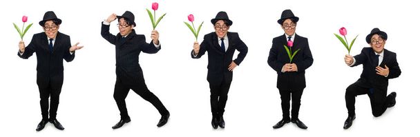 Young man in black costume with flower isolated on white - Photo, Image