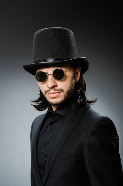 Vintage concept with man wearing black top hat - Photo, Image