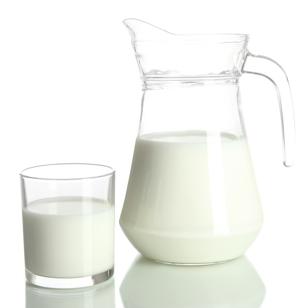 Tasty milk in jug and glass of milk isolated on white - Photo, image