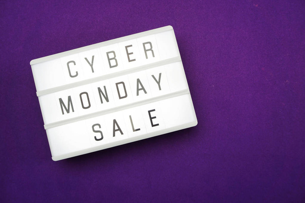 Cyber Monday alphabet letter with light box on purple background - Фото, изображение