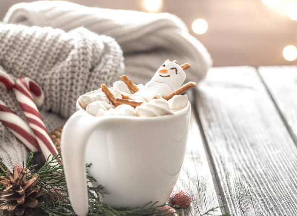 Christmas cocoa concept with marshmallows on a wooden background in a cozy festive atmosphere - Φωτογραφία, εικόνα