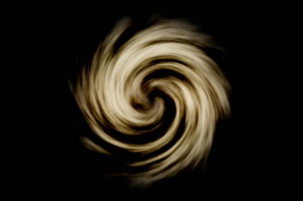 Abstract spiral galaxy with light brown smoke on black background - Photo, Image