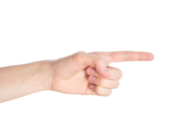 Pointing gesture. Female hand shows index finger on a white background isolate - Foto, afbeelding