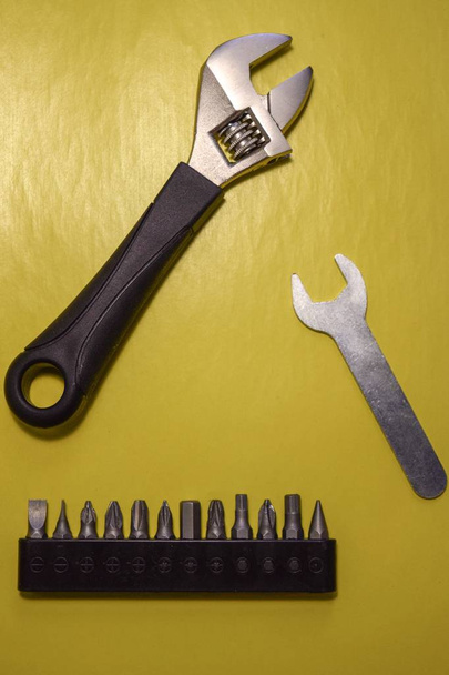  set of tools isolated on yellow background - Foto, afbeelding