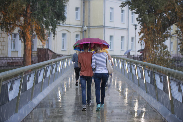 People in the rain with umbrellas. Bad weather - 写真・画像