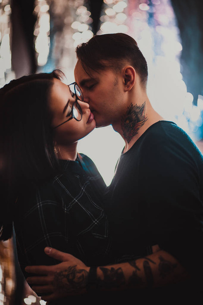 Beautiful couple kissing, on blurred smoke background. - Фото, зображення