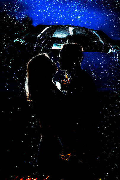 couple under an umbrella in the rain. - Φωτογραφία, εικόνα