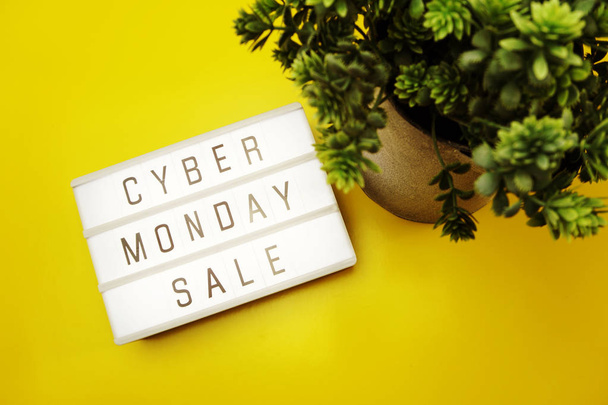 cyber monday sale flat lay top view on yellow background - Φωτογραφία, εικόνα