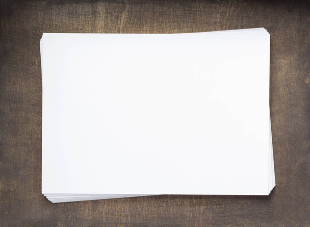 stack of paper with empty pages on wooden background, top view - Photo, image