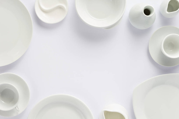 set of dishes on white background, top view - Φωτογραφία, εικόνα