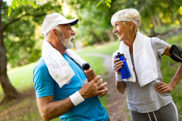 Happy senior people jogging to stay helathy and lose weight - Fotoğraf, Görsel
