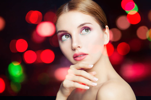 Beautiful woman with colorful makeup on bokeh glitter background - Foto, Imagem