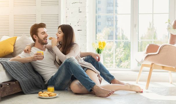 Happy loving couple in bedroom in the morning - Photo, Image