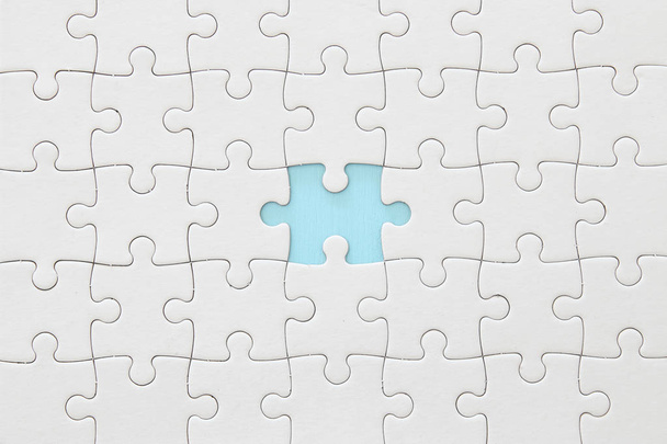background of white puzzle with missing piece - Photo, image