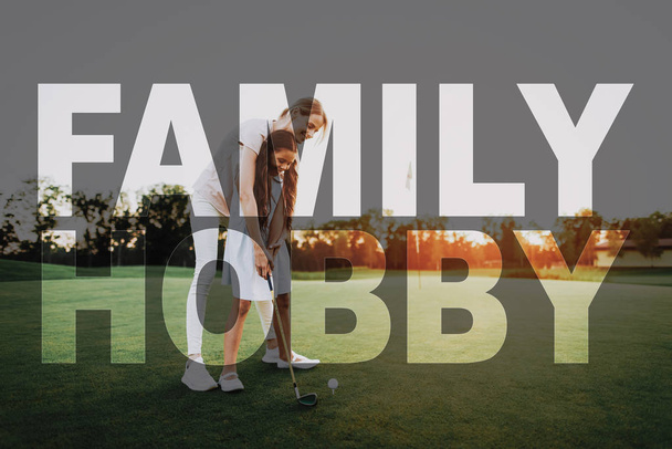 Mum Teaches the Kid Golfing. Family Hobby. Child is Learning to Take Shot. Summer Weekend. Woman and Kid in Sunset. Luxury Active Recreation. Family Leisure. Elite Sports. Transparent Text Effect. - Foto, Imagem