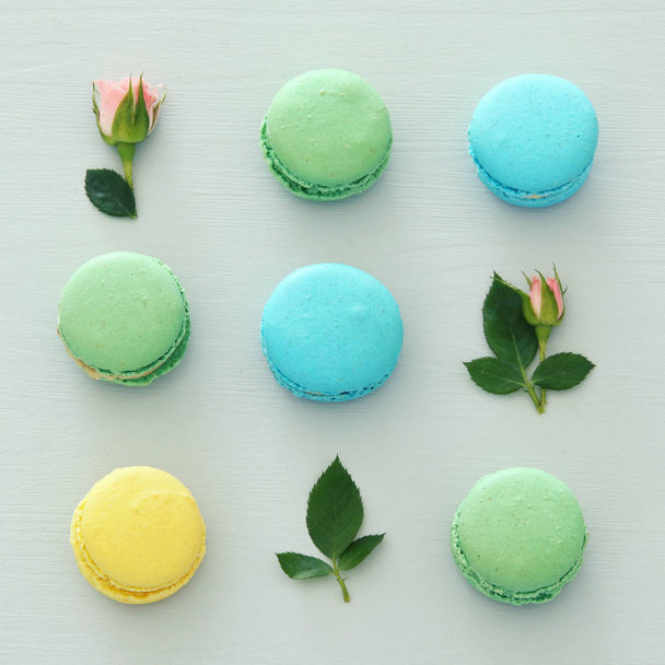 Top view of colorful macaron or macaroon over pastel blue background. Flat lay - Foto, Imagen