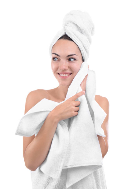 Beautiful young woman with towels on white background - Foto, imagen