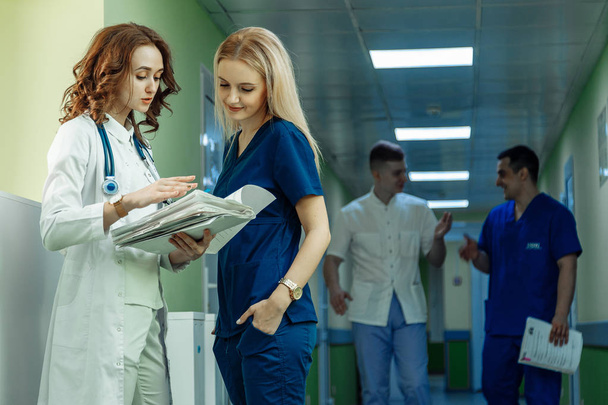 Healthcare people group. Professional doctor working in hospital office or clinic with other doctors, nurse and surgeo - Фото, зображення