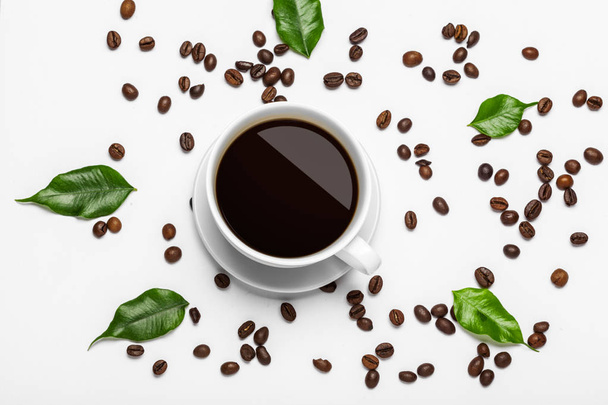 Coffee cup and beans on a white background - Valokuva, kuva